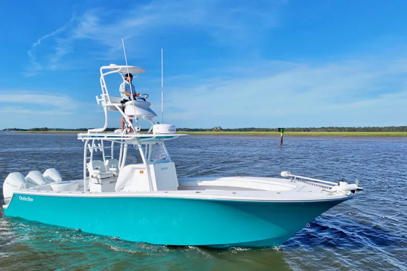  Yacht Photos Pics 2021 Onslow Bay 33 Tournament boat cruising on a sunny day with clear blue skies.