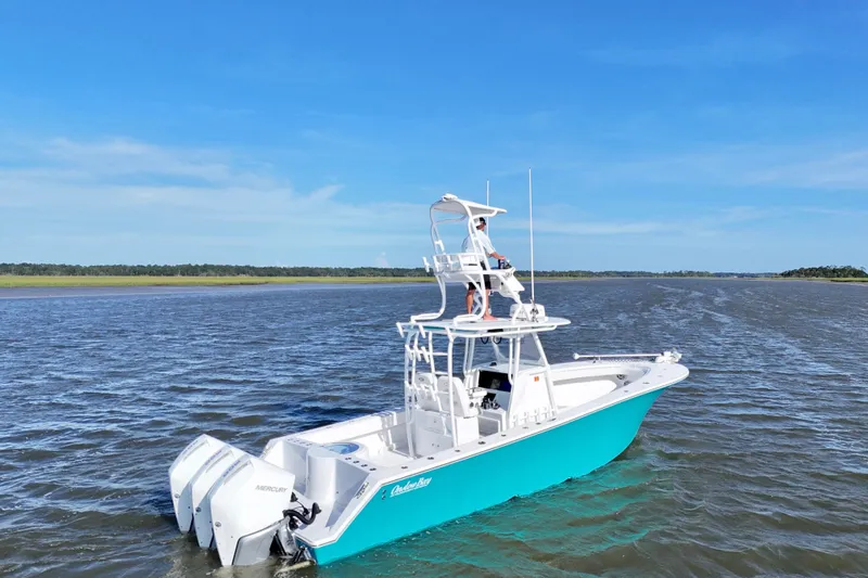  Yacht Photos Pics 2021 Onslow Bay 33 Tournament boat on open water under clear blue sky.