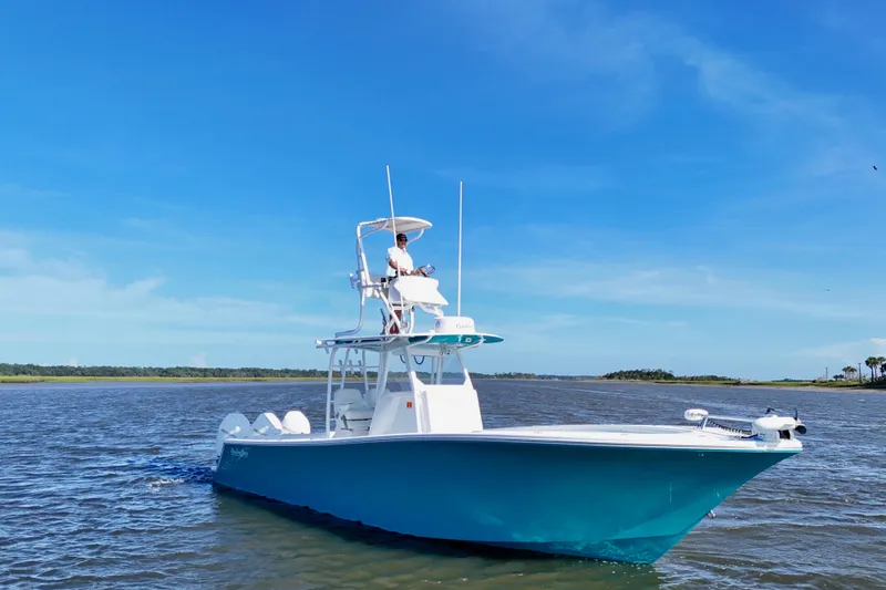  Yacht Photos Pics 2021 Onslow Bay 33 Tournament boat on calm water under clear blue sky.