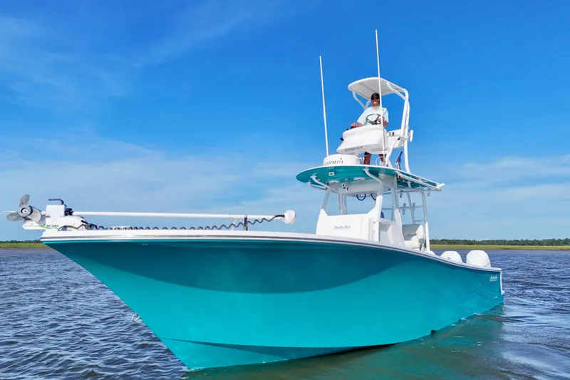  Yacht Photos Pics 2021 Onslow Bay 33 Tournament boat on water, clear blue sky background.