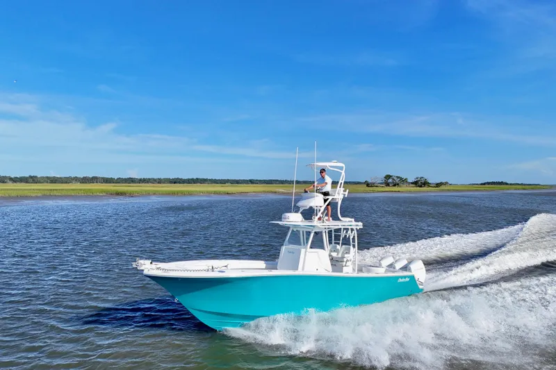  Yacht Photos Pics 2021 Onslow Bay 33 Tournament boat cruising on open water under clear blue sky.