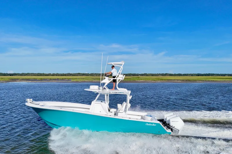  Yacht Photos Pics 2021 Onslow Bay 33 Tournament boat cruising on a sunny day.