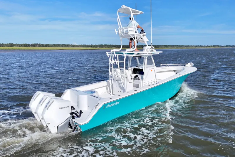  Yacht Photos Pics 2021 Onslow Bay 33 Tournament boat cruising on open water with twin Mercury engines.