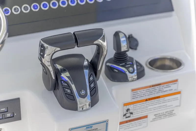  Yacht Photos Pics 2023 Edgewater 262CC boat controls with advanced throttle and joystick system.