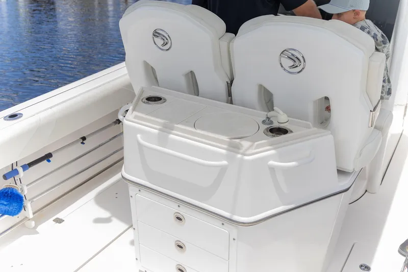  Yacht Photos Pics 2023 Edgewater 262CC boat interior with seating and storage compartments.
