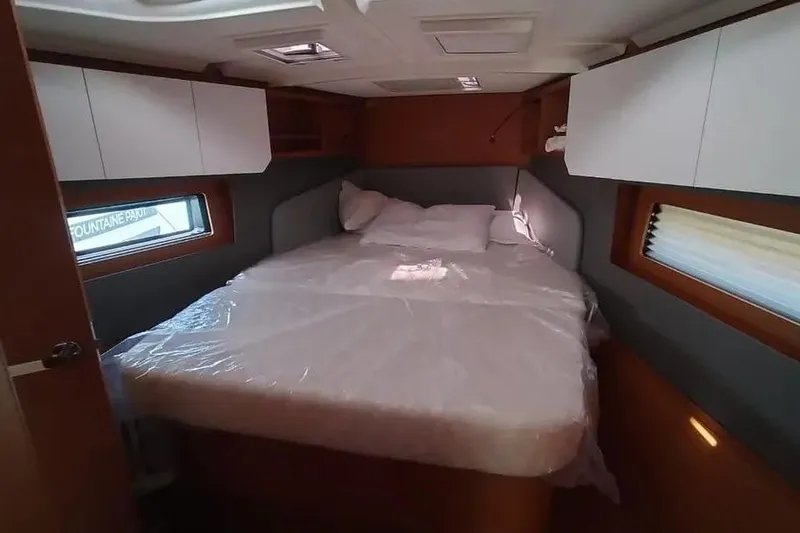  Yacht Photos Pics 2025 Dufour 41 yacht cabin with cozy bed and modern interior design.