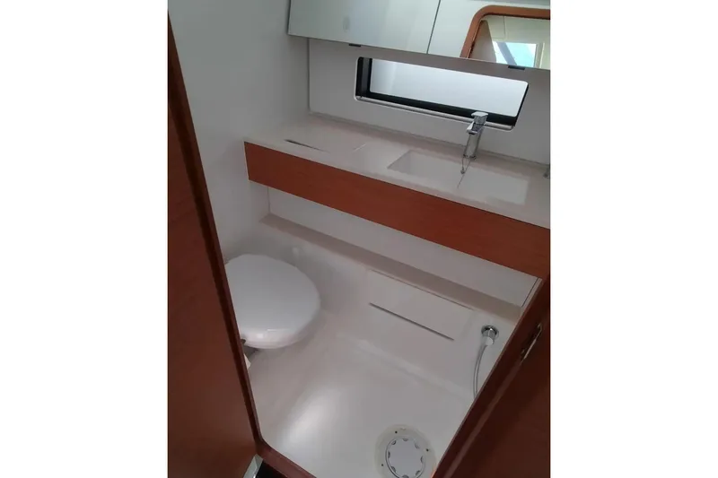  Yacht Photos Pics Modern bathroom in 2025 Dufour 41 yacht with sleek fixtures and wood accents.