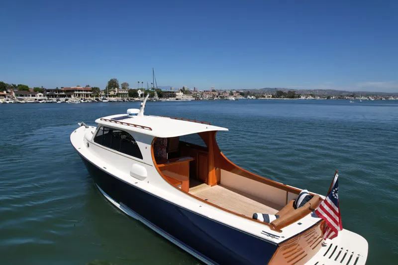 Picnic Yacht Photos Pics 2002 Palm Beach Motor Yachts Avalon 38 cruising on a sunny day in a marina.