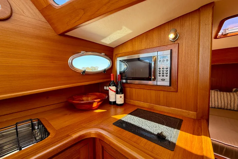 Picnic Yacht Photos Pics Luxurious wooden interior of 2002 Palm Beach Avalon 38 yacht kitchen.
