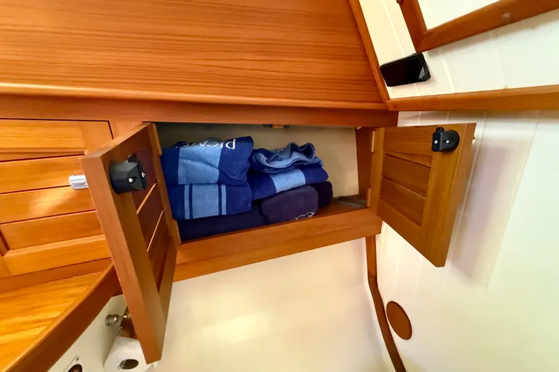 Picnic Yacht Photos Pics Wooden cabinet with towels inside on a 2002 Palm Beach Motor Yachts Avalon 38.