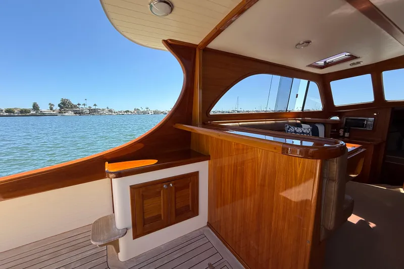 Picnic Yacht Photos Pics Interior of 2002 Palm Beach Motor Yachts Avalon 38, featuring elegant wood finishes and waterfront view.