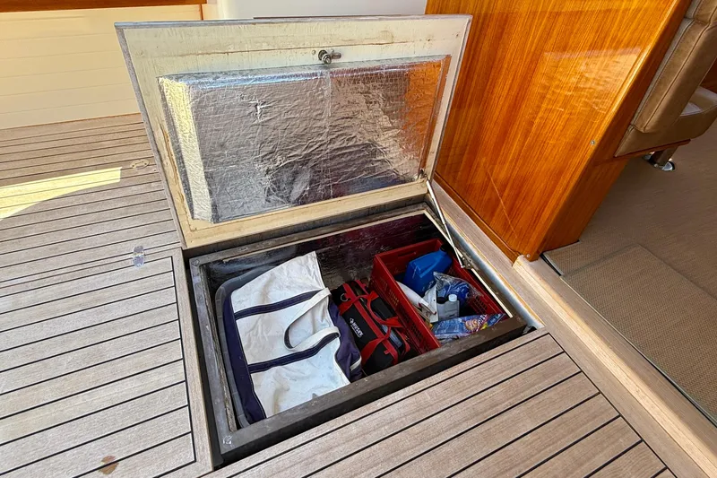 Picnic Yacht Photos Pics Storage compartment on 2002 Palm Beach Motor Yachts Avalon 38, featuring organized gear and equipment.