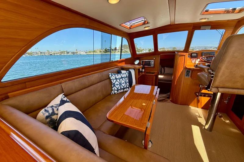 Picnic Yacht Photos Pics Luxurious interior of 2002 Palm Beach Motor Yachts Avalon 38 with elegant wood finish.