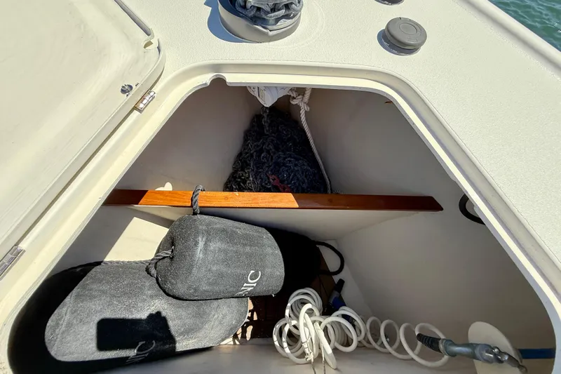 Picnic Yacht Photos Pics Storage compartment of 2002 Palm Beach Motor Yachts Avalon 38 with ropes and fenders.