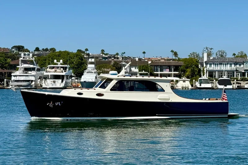 Picnic Yacht Photos Pics 2002 Palm Beach Motor Yachts Avalon 38 cruising on a sunny day near a marina.