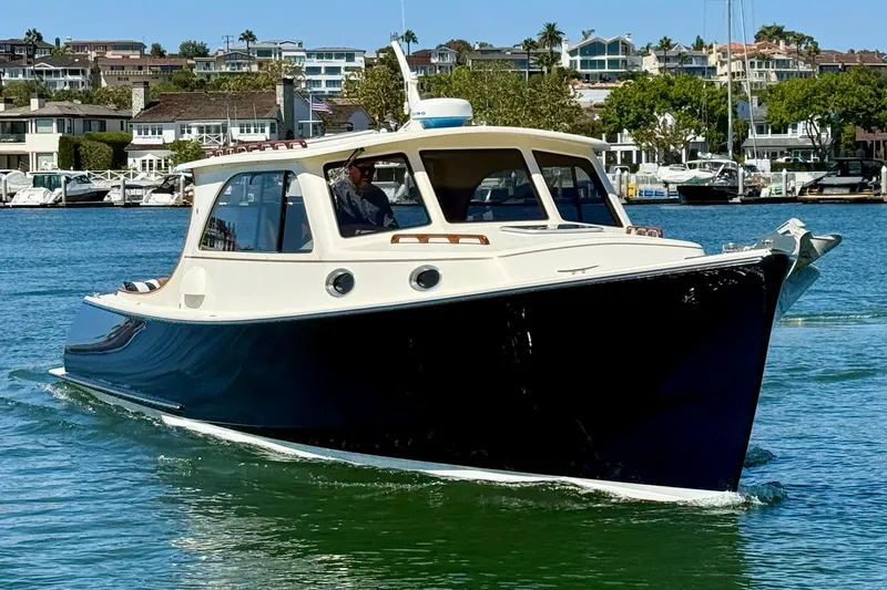 Picnic Yacht Photos Pics 2002 Palm Beach Motor Yachts Avalon 38 cruising in a scenic marina setting.