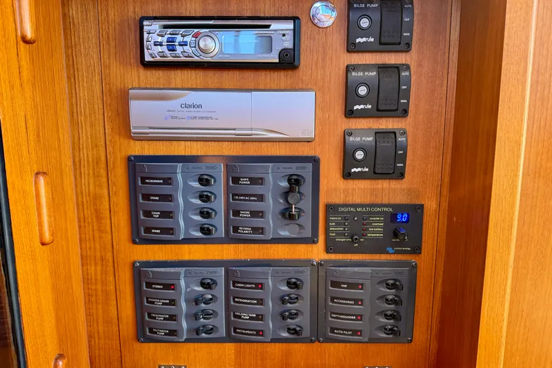 Picnic Yacht Photos Pics Control panel of 2002 Palm Beach Motor Yachts Avalon 38 with audio system and switches.