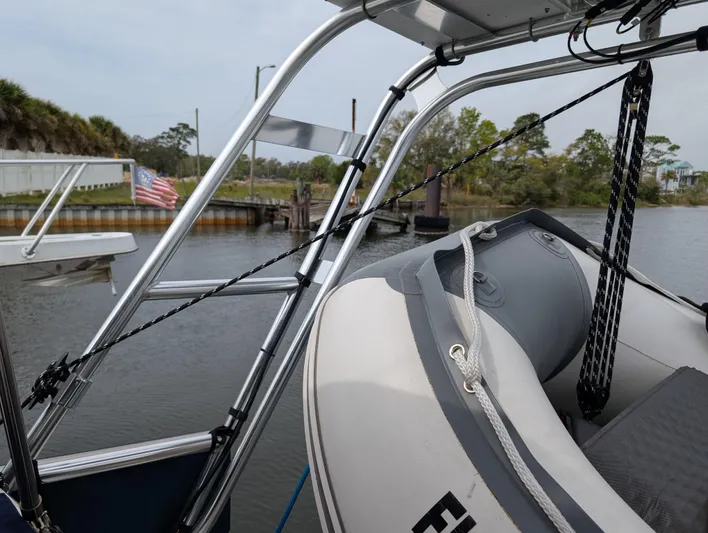 Seastar Yacht Photos Pics Beneteau Oceanis 473 sailboat with dinghy, docked in a serene marina, 2003 model.