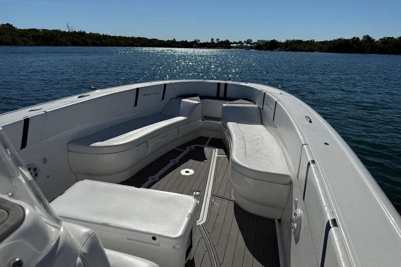  Yacht Photos Pics 2020 Midnight Express 34 Open boat with spacious seating on calm water.