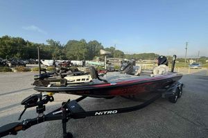 2022 Nitro Z21 XL Pro bass boat on trailer in parking lot.