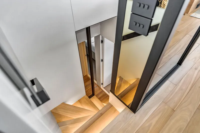 Notynog Yacht Photos Pics Modern wooden staircase on Sanlorenzo SL90A yacht, 2022 model, with sleek design and ambient lighting.