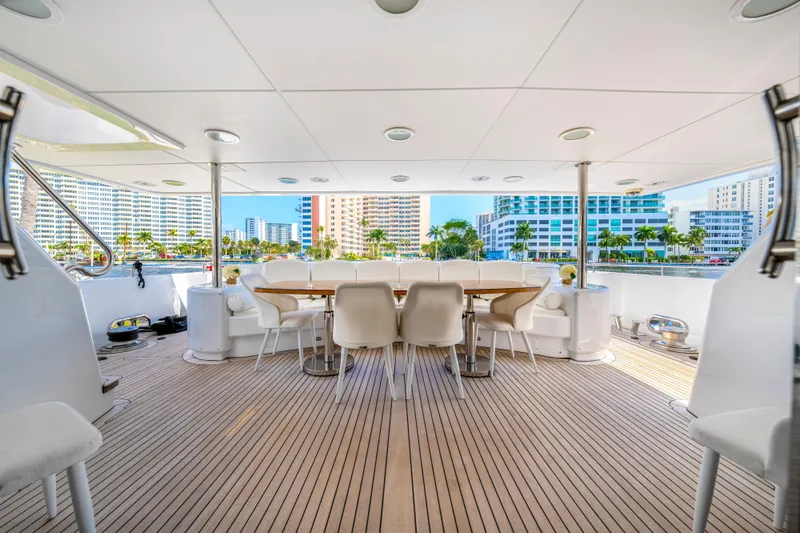 The Pearl Yacht Photos Pics Spacious deck of 1998 Intermarine 118 yacht with elegant dining area.