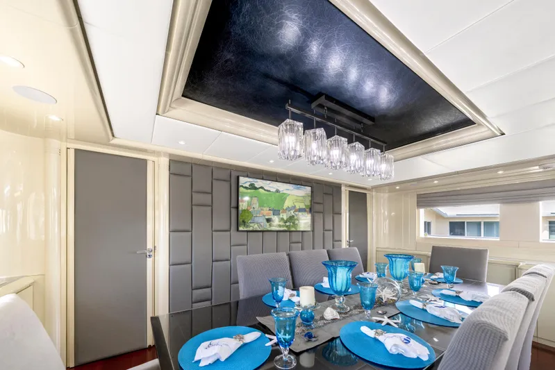 The Pearl Yacht Photos Pics Luxurious dining area on 1998 Intermarine 118 yacht with elegant table setting and modern decor.