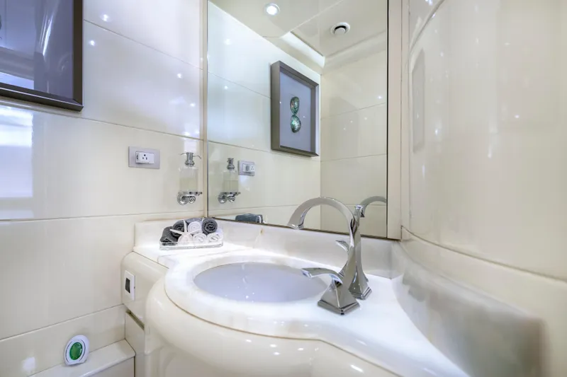 The Pearl Yacht Photos Pics Luxurious bathroom in 1998 Intermarine 118 yacht with modern fixtures and elegant design.