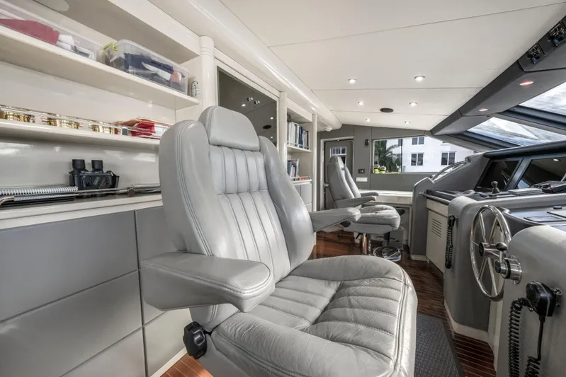 The Pearl Yacht Photos Pics Luxurious 1998 Intermarine 118 yacht interior with plush seating and modern helm controls.