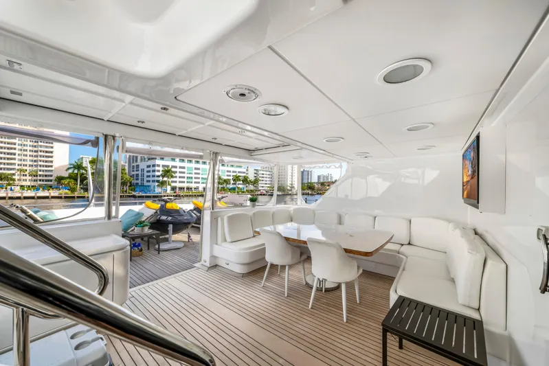 The Pearl Yacht Photos Pics Luxurious 1998 Intermarine 118 yacht interior with elegant seating and waterfront view.