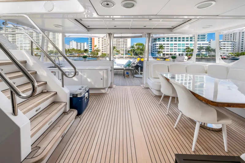 The Pearl Yacht Photos Pics Luxurious 1998 Intermarine 118 yacht interior with elegant seating and wooden flooring.