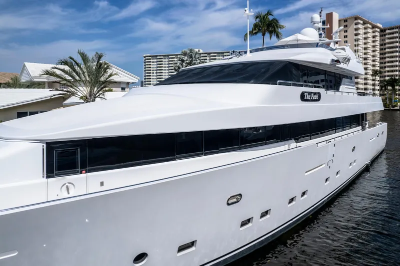 The Pearl Yacht Photos Pics Luxury 1998 Intermarine 118 yacht docked near waterfront buildings.