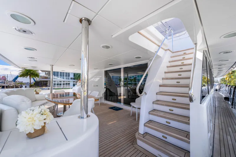 The Pearl Yacht Photos Pics Luxurious 1998 Intermarine 118 yacht interior with elegant seating and staircase.