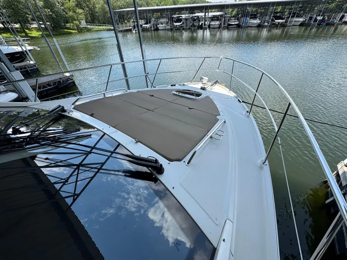 Finale Yacht Photos Pics 2017 Sea Ray Sundancer 400 yacht docked by a serene marina.