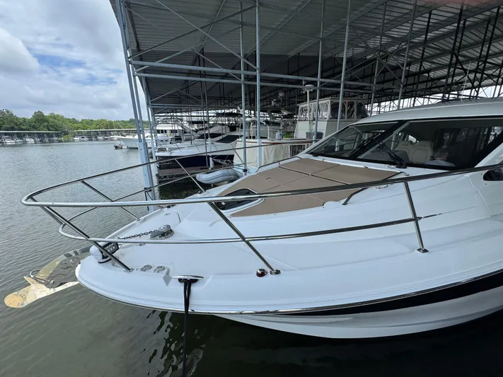 Finale Yacht Photos Pics 2017 Sea Ray Sundancer 400 docked in a marina under a covered structure.