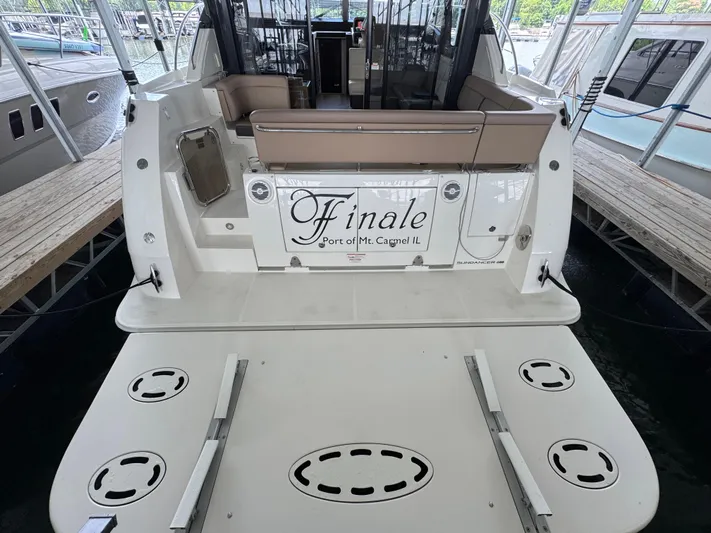 Finale Yacht Photos Pics 2017 Sea Ray Sundancer 400 yacht docked, rear view with seating and "Finale" nameplate.