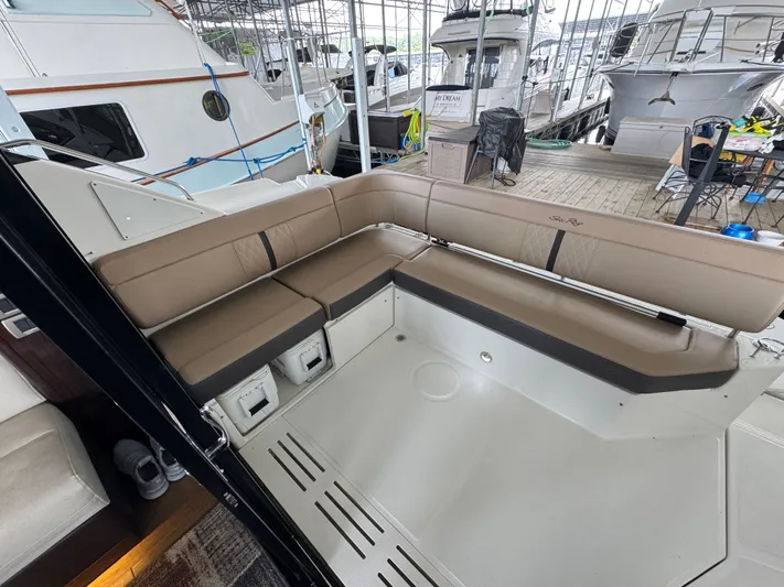 Finale Yacht Photos Pics 2017 Sea Ray Sundancer 400 yacht with spacious outdoor seating area in marina.