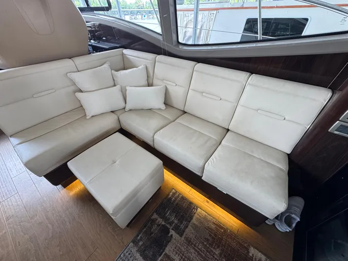 Finale Yacht Photos Pics Luxurious interior of 2017 Sea Ray Sundancer 400 with cream leather seating and cushions.