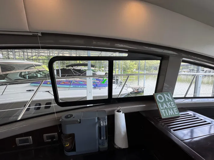 Finale Yacht Photos Pics Interior view of 2017 Sea Ray Sundancer 400 yacht with lake scenery outside.