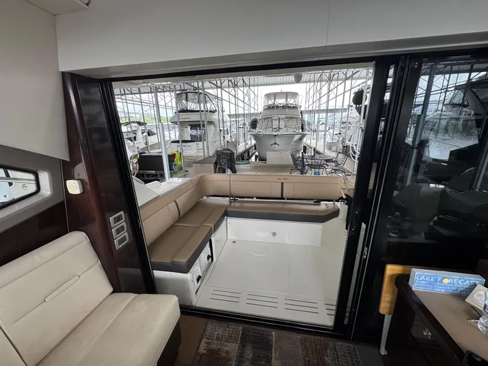 Finale Yacht Photos Pics 2017 Sea Ray Sundancer 400 interior with spacious seating and marina view.