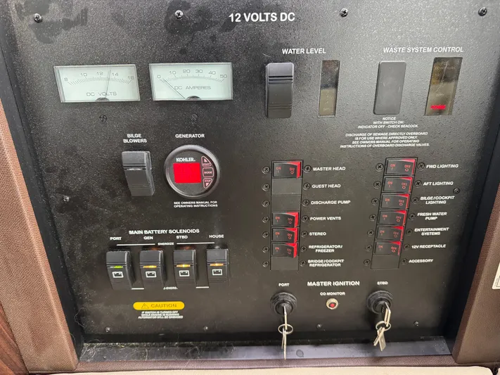 Finale Yacht Photos Pics Control panel of a 2017 Sea Ray Sundancer 400 yacht, featuring various switches and gauges.