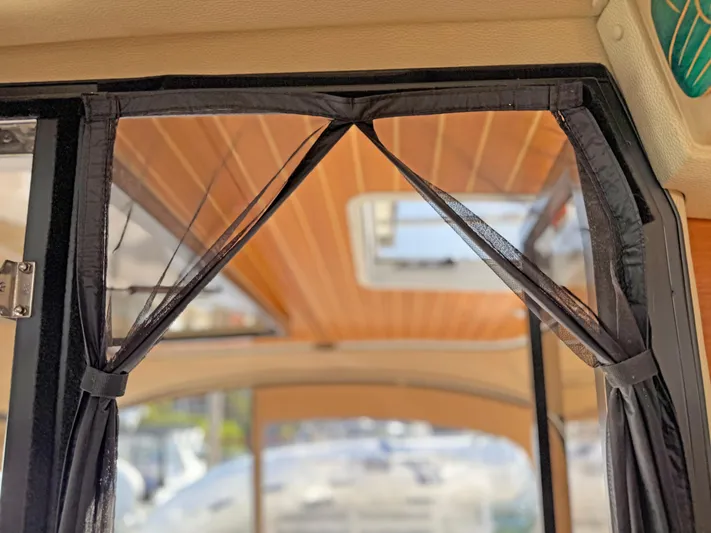 Salty Growler Yacht Photos Pics Interior view of 2017 Ranger Tugs R-29 S with wooden ceiling and window.