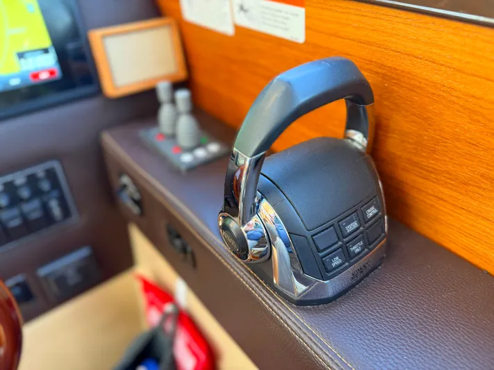 Salty Growler Yacht Photos Pics Control panel of a 2017 Ranger Tugs R-29 S boat, featuring modern navigation equipment.