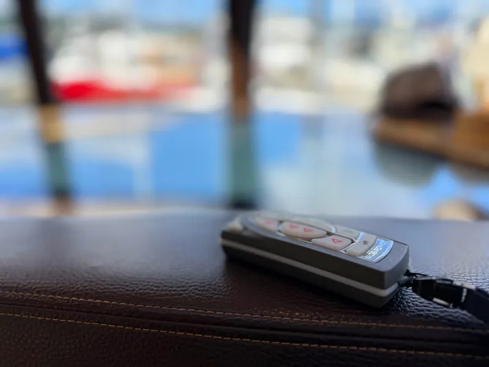 Salty Growler Yacht Photos Pics Remote control on leather surface inside 2017 Ranger Tugs R-29 S boat.