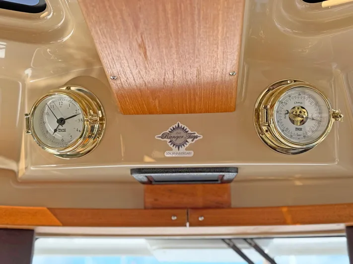 Salty Growler Yacht Photos Pics Gold nautical instruments on 2017 Ranger Tugs R-29 S dashboard.