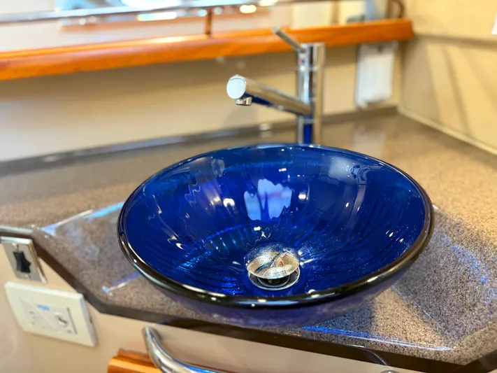 Salty Growler Yacht Photos Pics Blue glass sink in 2017 Ranger Tugs R-29 S boat bathroom.