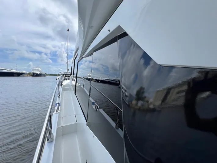  Yacht Photos Pics Galeon 680 Fly yacht, 2020 model, docked with sleek design and reflective surfaces.