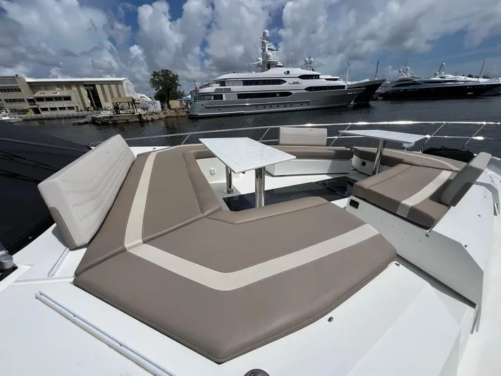  Yacht Photos Pics Luxurious seating area on 2020 Galeon 680 Fly yacht with scenic marina backdrop.