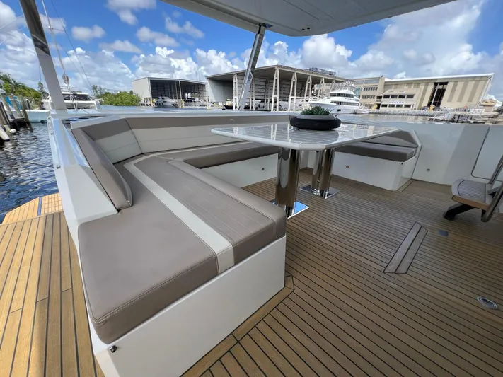 Yacht Photos Pics Luxurious seating area on a 2020 Galeon 680 Fly yacht, featuring elegant wood decking.