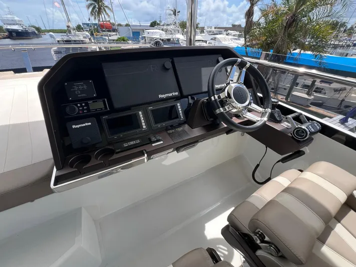  Yacht Photos Pics Helm of 2020 Galeon 680 Fly yacht with Raymarine navigation system and luxurious seating.
